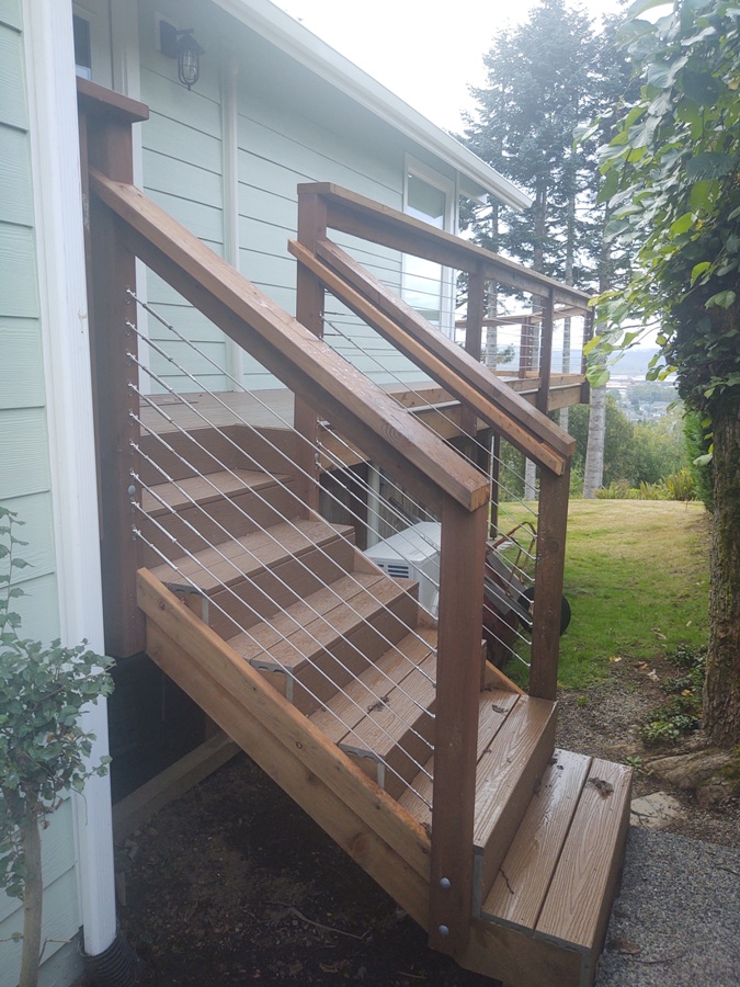 Composite deck stairs with cable railing