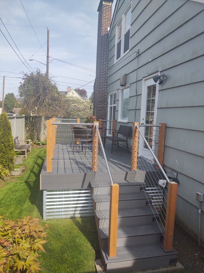 Composite deck with galvanized steel handrails and cable railing