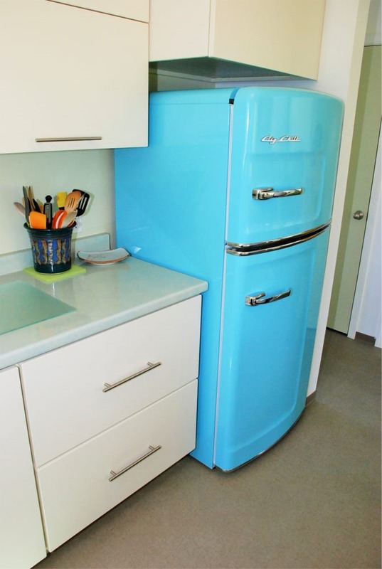 Blue retro style refrigerator was installed in this kitchen