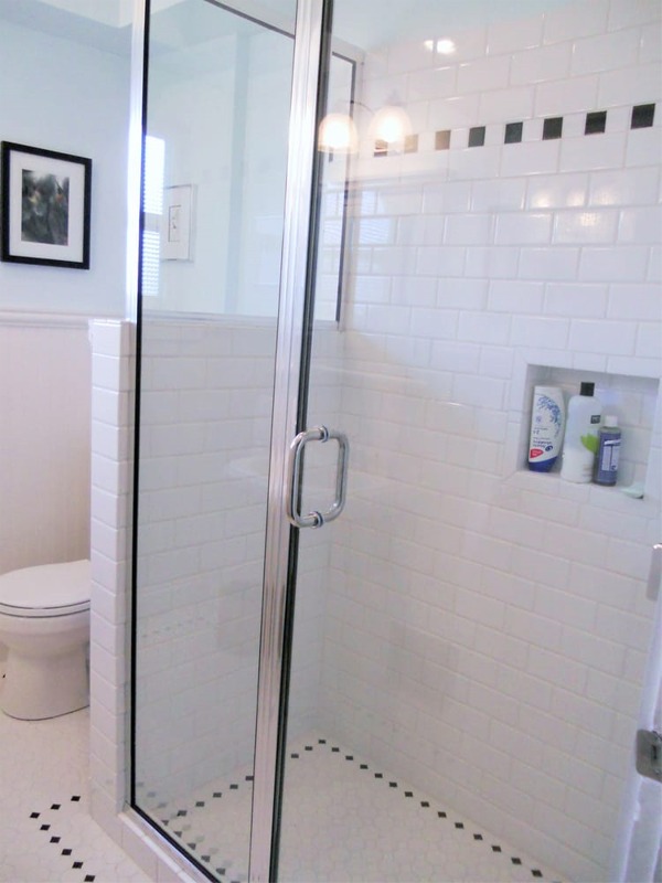 New tile shower stall with glass door